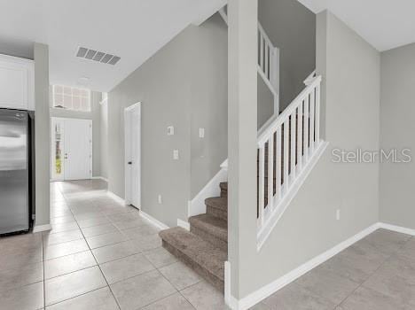 3137 Marine Grass Dr, Wimauma, FL 33598 - stairway featuring tile patterned flooring and baseboards