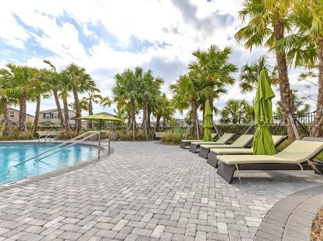 3137 Marine Grass Dr, Wimauma, FL 33598 - community pool featuring a patio area