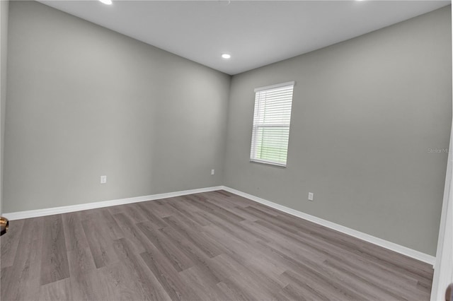 3137 Marine Grass Dr, Wimauma, FL 33598 - unfurnished room featuring wood finished floors, baseboards, and recessed lighting