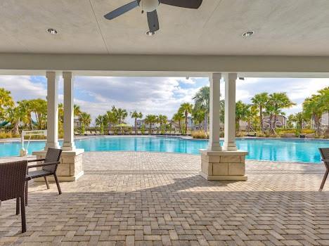 3137 Marine Grass Dr, Wimauma, FL 33598 - community pool featuring ceiling fan and a patio