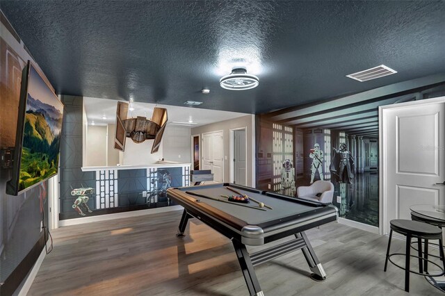 1533 Flange Dr, Davenport, FL 33896 - playroom featuring billiards, a textured ceiling, wood finished floors, and baseboards