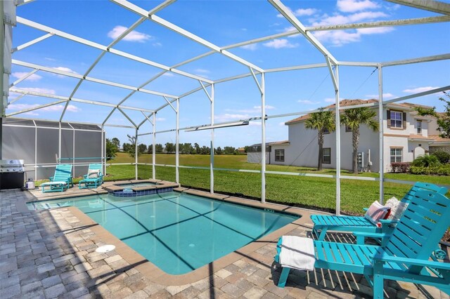 1533 Flange Dr, Davenport, FL 33896 - view of swimming pool featuring a yard, a patio, a pool with connected hot tub, and glass enclosure