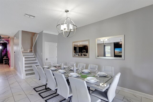 1533 Flange Dr, Davenport, FL 33896 - dining space with light marble finish flooring, a chandelier, stairway, and baseboards