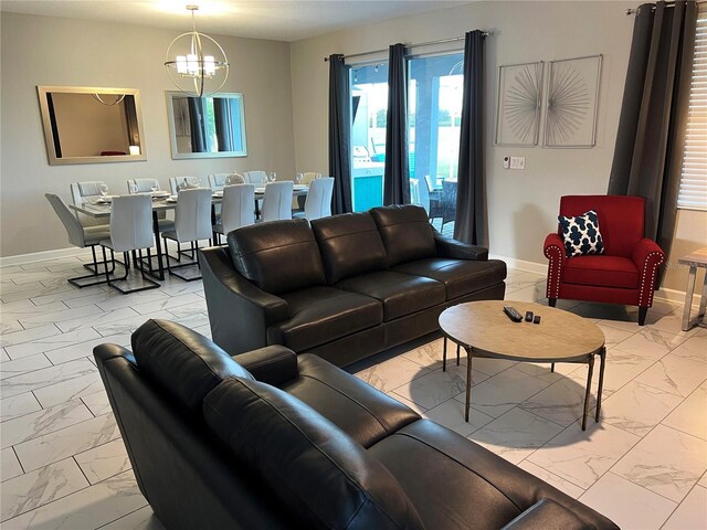 1533 Flange Dr, Davenport, FL 33896 - living area with marble finish floors, baseboards, and a chandelier