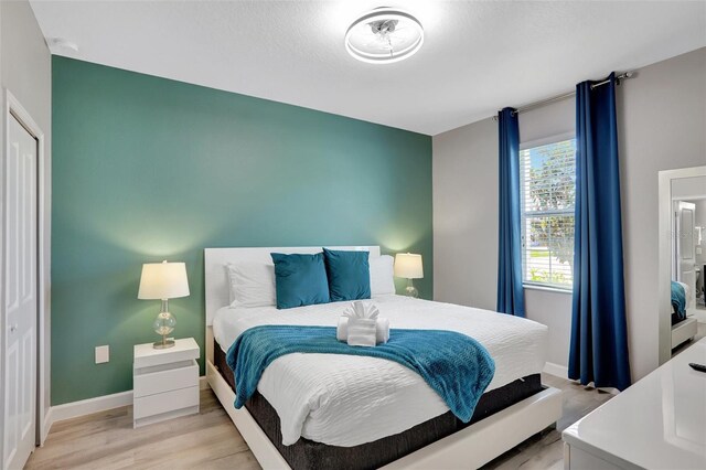 1533 Flange Dr, Davenport, FL 33896 - bedroom featuring light wood finished floors and baseboards