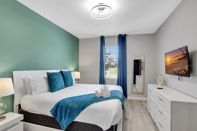 1533 Flange Dr, Davenport, FL 33896 - bedroom with light wood-type flooring and baseboards
