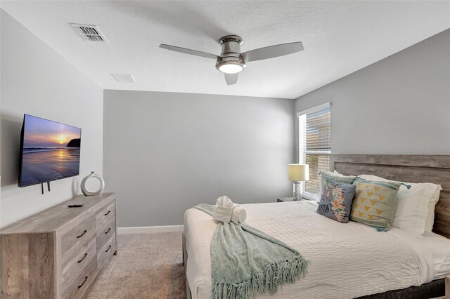 1533 Flange Dr, Davenport, FL 33896 - bedroom with light colored carpet, ceiling fan, and baseboards