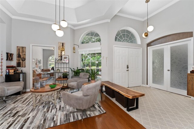 13108 Lakeshore Grove Dr, Winter Garden, FL 34787 - living room with a high ceiling, ornamental molding, french doors, and baseboards