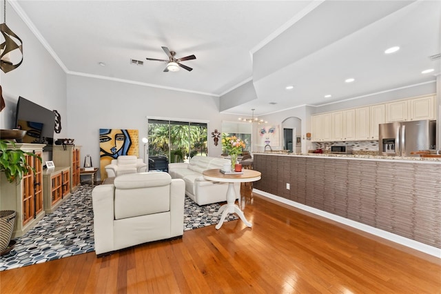 13108 Lakeshore Grove Dr, Winter Garden, FL 34787 - living area featuring light wood-style flooring, ceiling fan, ornamental molding, a chandelier, and recessed lighting