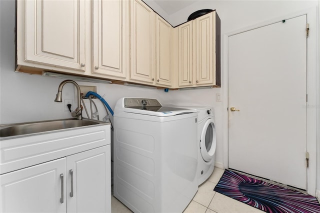 13108 Lakeshore Grove Dr, Winter Garden, FL 34787 - laundry area with washing machine and dryer, light tile patterned floors, and cabinet space