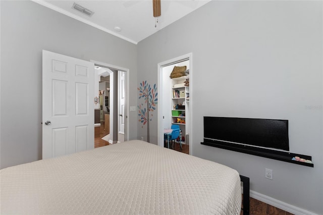13108 Lakeshore Grove Dr, Winter Garden, FL 34787 - bedroom featuring wood finished floors, a closet, ornamental molding, baseboards, and ceiling fan