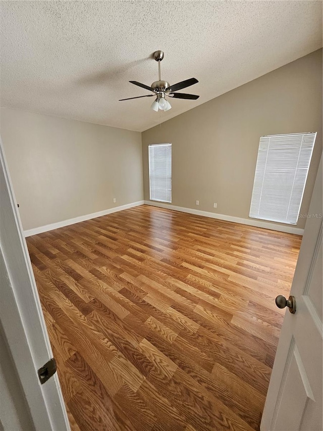 1710 Canoe Creek Rd, Oviedo, FL 32766 - spare room featuring wood finished floors, a ceiling fan, a textured ceiling, and baseboards