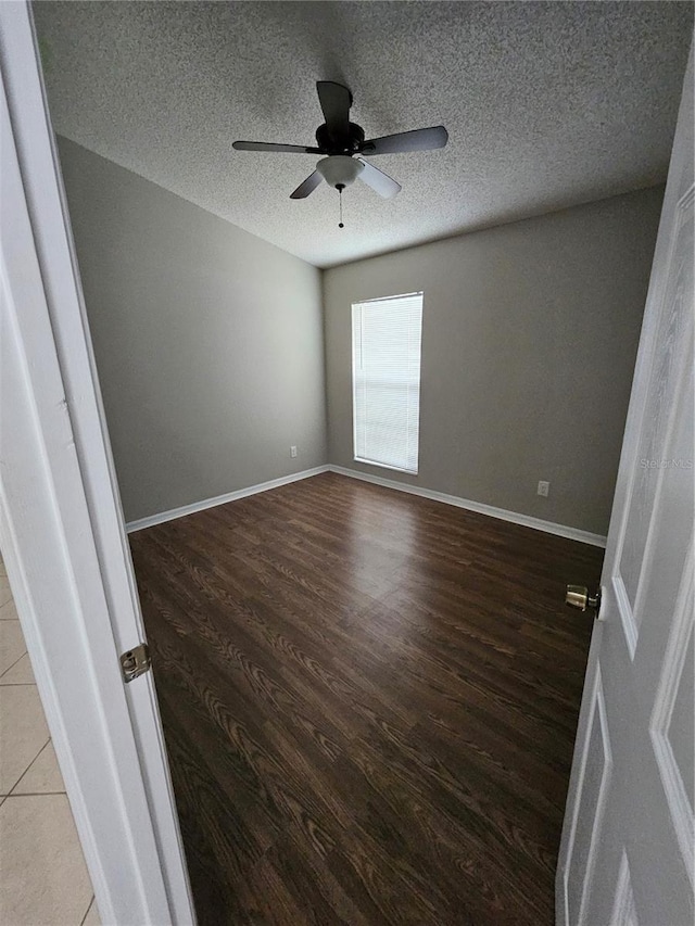 1710 Canoe Creek Rd, Oviedo, FL 32766 - empty room featuring wood finished floors, ceiling fan, a textured ceiling, and baseboards