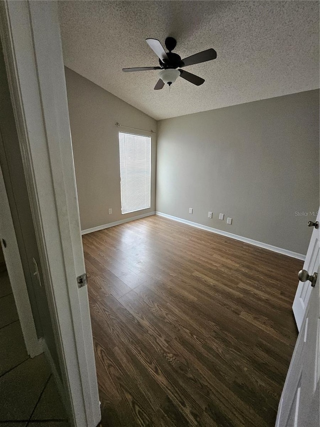 1710 Canoe Creek Rd, Oviedo, FL 32766 - spare room with dark wood-style flooring, a ceiling fan, baseboards, and a textured ceiling