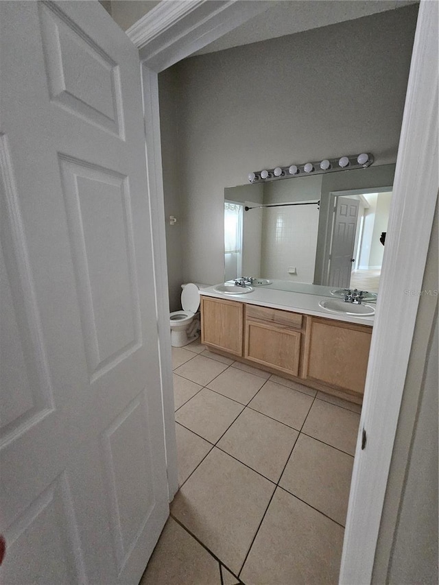 1710 Canoe Creek Rd, Oviedo, FL 32766 - bathroom with tile patterned flooring, toilet, and double vanity