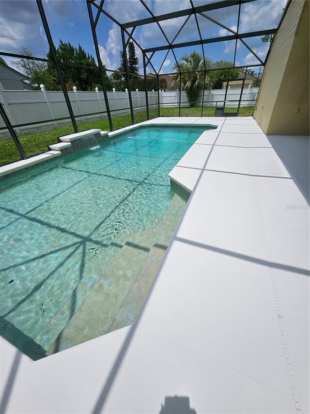 1710 Canoe Creek Rd, Oviedo, FL 32766 - view of swimming pool with a fenced backyard, glass enclosure, and a patio area
