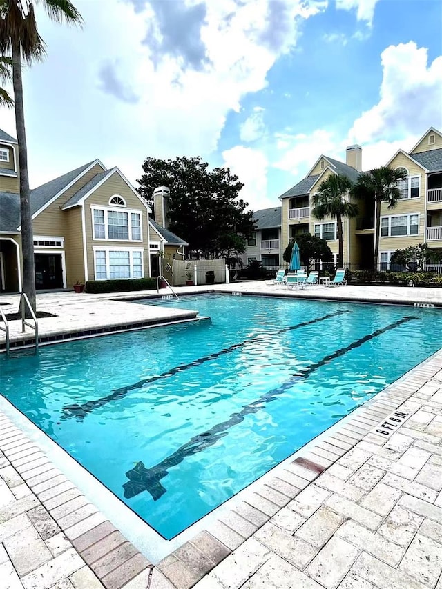 1057 S Hiawassee Rd Unit 1913, Orlando, FL 32835 - community pool featuring a patio