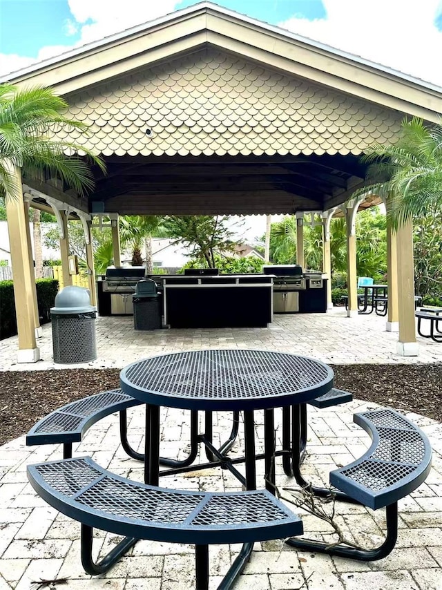 1057 S Hiawassee Rd Unit 1913, Orlando, FL 32835 - view of patio with a gazebo and outdoor dining area