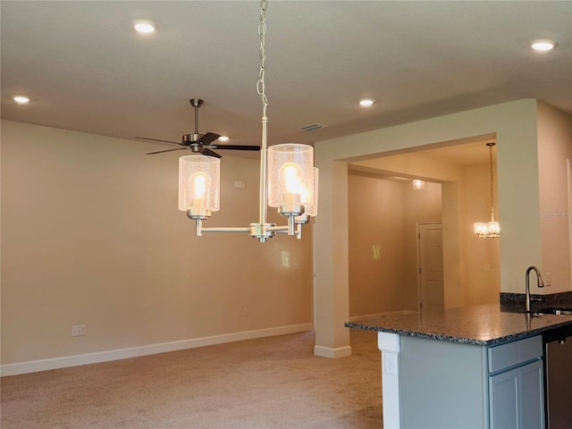 4326 Sagefield Dr, Harmony, FL 34773 - kitchen with recessed lighting, light carpet, dark stone countertops, baseboards, and ceiling fan