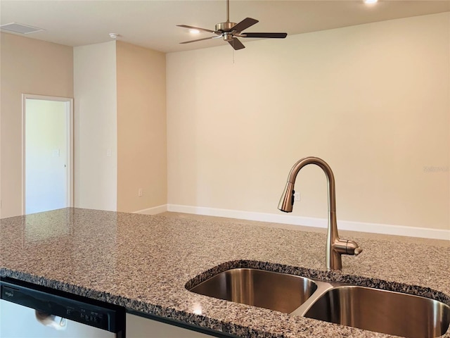 4326 Sagefield Dr, Harmony, FL 34773 - kitchen with a sink, dishwashing machine, dark stone counters, ceiling fan, and recessed lighting