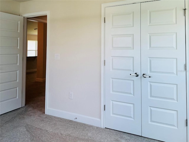 4326 Sagefield Dr, Harmony, FL 34773 - unfurnished bedroom with carpet, baseboards, and a closet