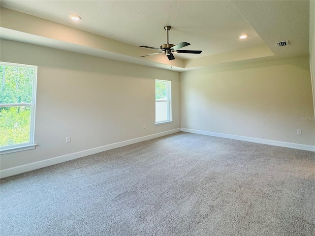 4326 Sagefield Dr, Harmony, FL 34773 - carpeted empty room featuring baseboards, a ceiling fan, recessed lighting, a raised ceiling, and a textured ceiling