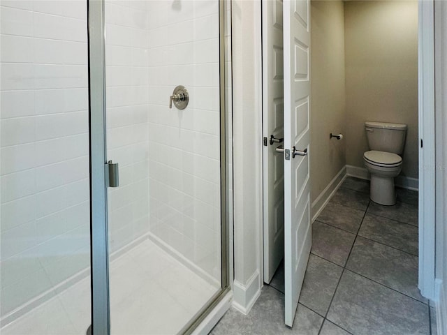 4326 Sagefield Dr, Harmony, FL 34773 - full bathroom with a stall shower, toilet, and tile patterned flooring