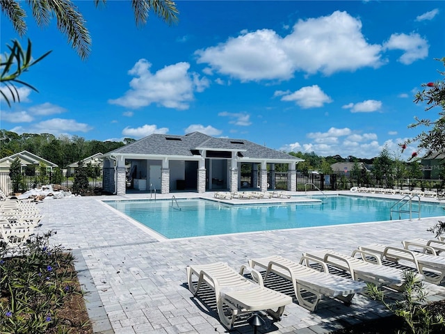 4326 Sagefield Dr, Harmony, FL 34773 - community pool with a patio