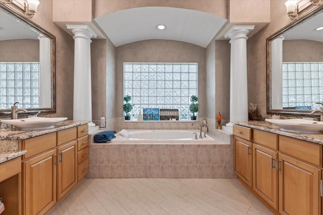 2046 Westover Reserve Blvd, Windermere, FL 34786 - bathroom with ornate columns, healthy amount of natural light, and a bath