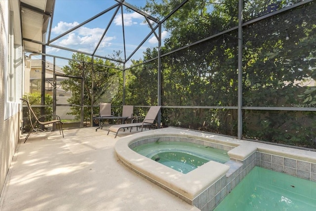 2046 Westover Reserve Blvd, Windermere, FL 34786 - view of pool with an in-ground hot tub, glass enclosure, and a patio area