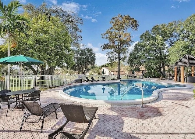 3044 S Oakland Forest Dr Unit 2403, Oakland Park, FL 33309 - community pool featuring a patio and a gazebo