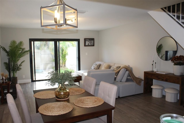 3044 S Oakland Forest Dr Unit 2403, Oakland Park, FL 33309 - dining space featuring wood finished floors and a chandelier