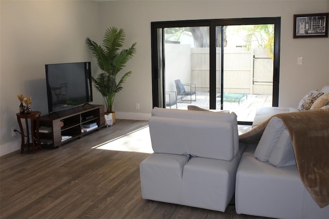 3044 S Oakland Forest Dr Unit 2403, Oakland Park, FL 33309 - living room featuring wood finished floors and baseboards