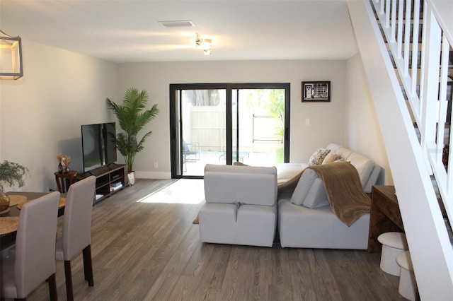3044 S Oakland Forest Dr Unit 2403, Oakland Park, FL 33309 - living room featuring stairway, wood finished floors, and baseboards