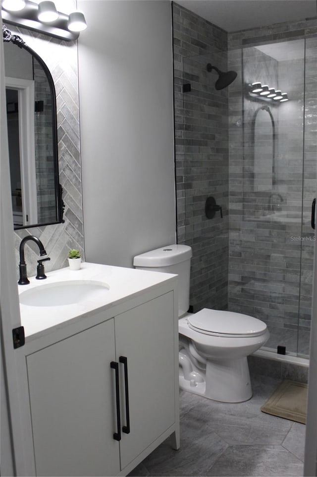 3044 S Oakland Forest Dr Unit 2403, Oakland Park, FL 33309 - bathroom with vanity, a stall shower, and toilet