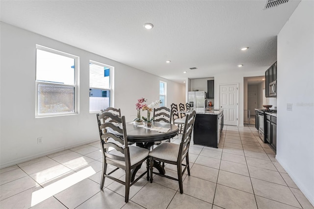 29400 Caspian St, Leesburg, FL 34748 - dining space featuring recessed lighting, light tile patterned floors, and baseboards