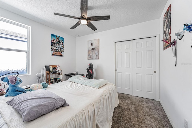 29400 Caspian St, Leesburg, FL 34748 - bedroom with carpet floors, a textured ceiling, a closet, ceiling fan, and baseboards