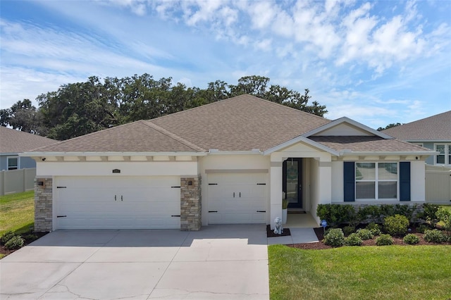 10815 Laxer Cay Loop, San Antonio, FL 33576 - ranch-style house featuring roof with shingles, a garage, concrete driveway, and stone siding