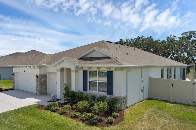 10815 Laxer Cay Loop, San Antonio, FL 33576 - single story home featuring stone siding, a garage, concrete driveway, a shingled roof, and stucco siding