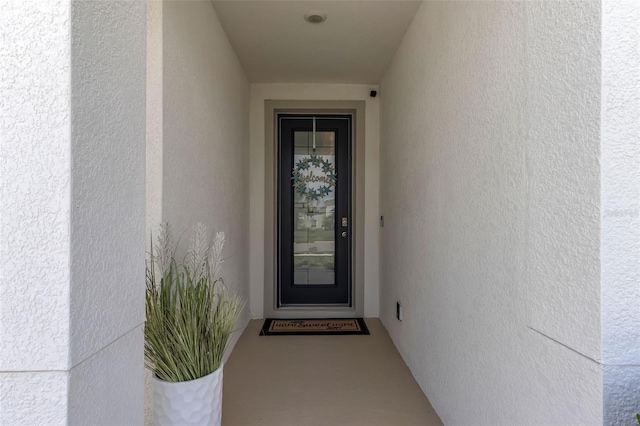 10815 Laxer Cay Loop, San Antonio, FL 33576 - doorway to property with stucco siding