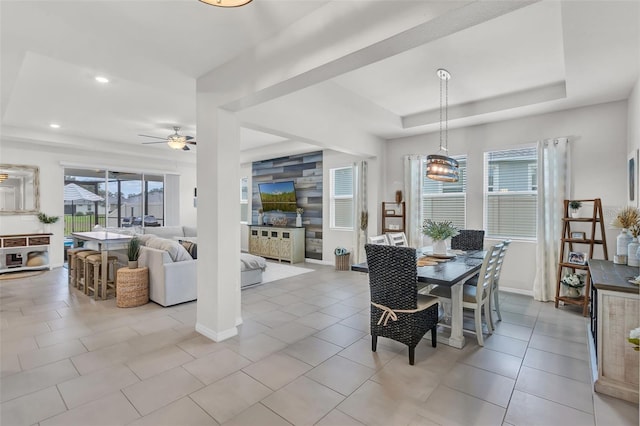 10815 Laxer Cay Loop, San Antonio, FL 33576 - dining room with a raised ceiling, ceiling fan, recessed lighting, baseboards, and tile patterned flooring