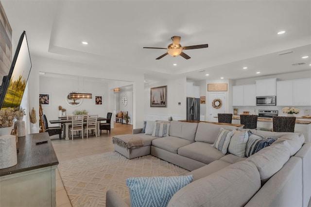 10815 Laxer Cay Loop, San Antonio, FL 33576 - living room featuring a ceiling fan, recessed lighting, and light tile patterned floors