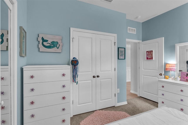 10815 Laxer Cay Loop, San Antonio, FL 33576 - carpeted bedroom featuring a closet and baseboards