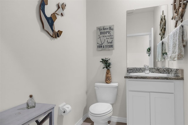 10815 Laxer Cay Loop, San Antonio, FL 33576 - bathroom with toilet, vanity, and baseboards