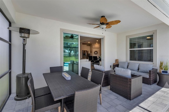 10815 Laxer Cay Loop, San Antonio, FL 33576 - view of patio / terrace featuring ceiling fan, an outdoor living space, and outdoor dining area