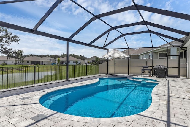 10815 Laxer Cay Loop, San Antonio, FL 33576 - view of swimming pool with a patio, a residential view, a pool with connected hot tub, grilling area, and a lanai