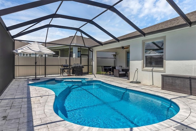 10815 Laxer Cay Loop, San Antonio, FL 33576 - view of pool featuring a patio area, a pool with connected hot tub, ceiling fan, and a lanai