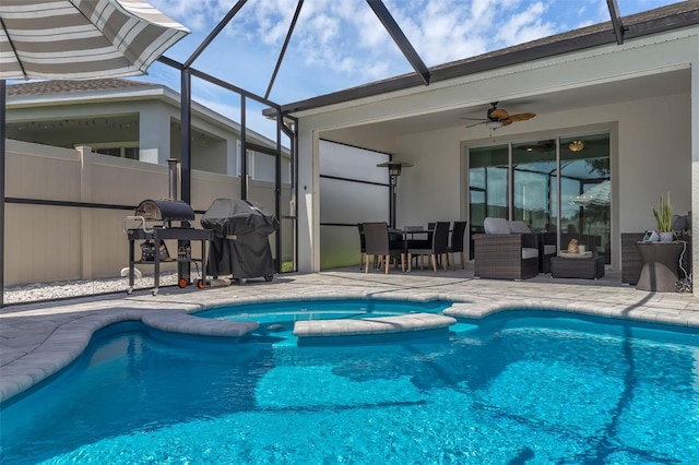 10815 Laxer Cay Loop, San Antonio, FL 33576 - view of swimming pool with a patio area, a pool with connected hot tub, and a lanai