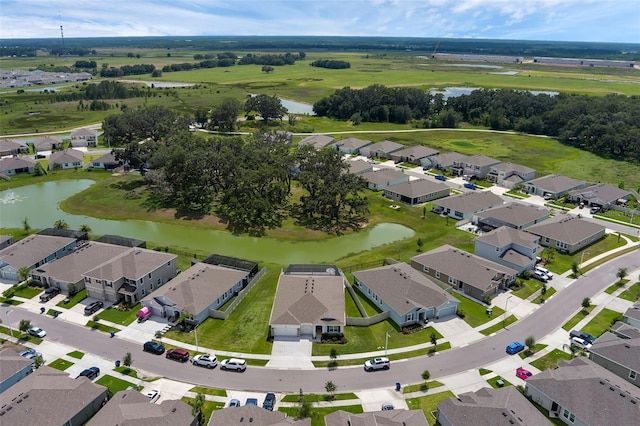 10815 Laxer Cay Loop, San Antonio, FL 33576 - aerial view of property and surrounding area with a large body of water and nearby suburban area