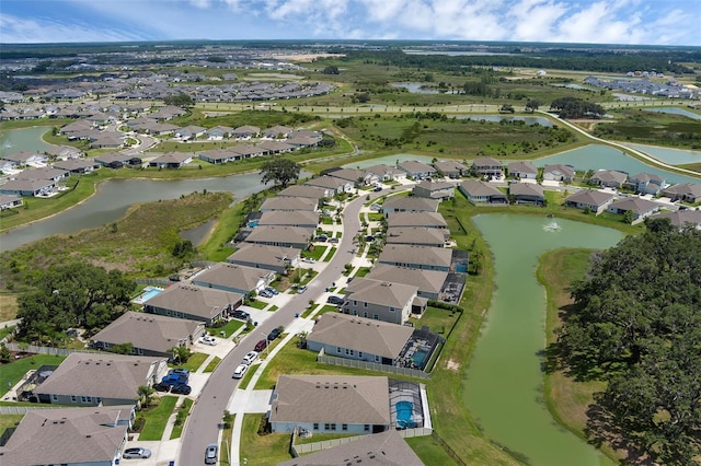 10815 Laxer Cay Loop, San Antonio, FL 33576 - aerial view of property and surrounding area featuring nearby suburban area and a nearby body of water